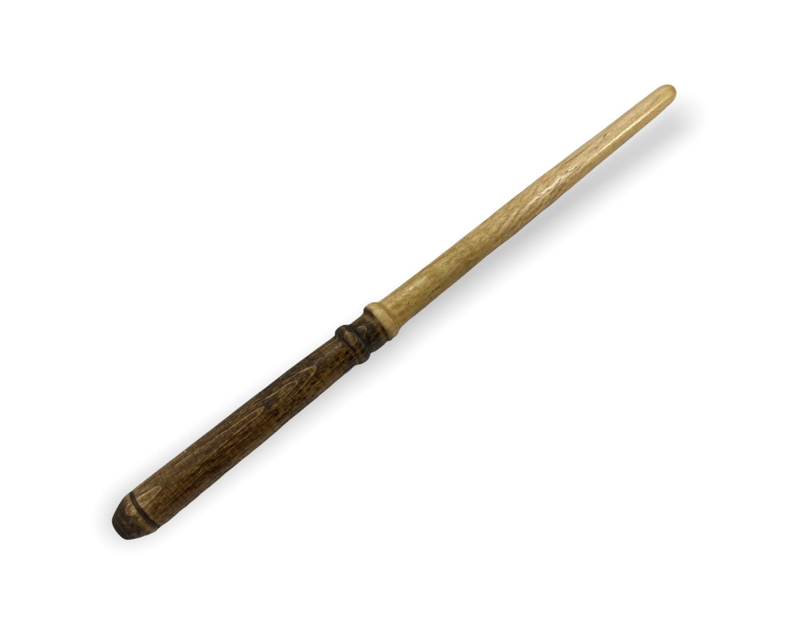 A handcrafted two-tone White Owl wooden wand